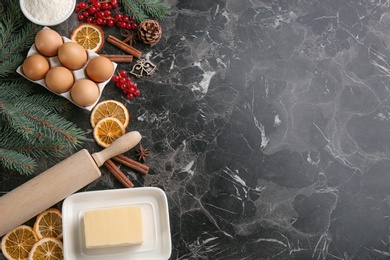 Photo of Flat lay composition with ingredients for homemade Christmas cookies on grey table, space for text