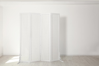 Modern folding screen in light spacious room