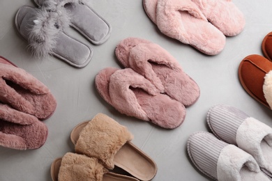 Photo of Many different soft slippers on light grey background, flat lay