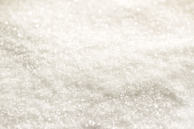 Photo of Pile of granulated sugar as background, closeup