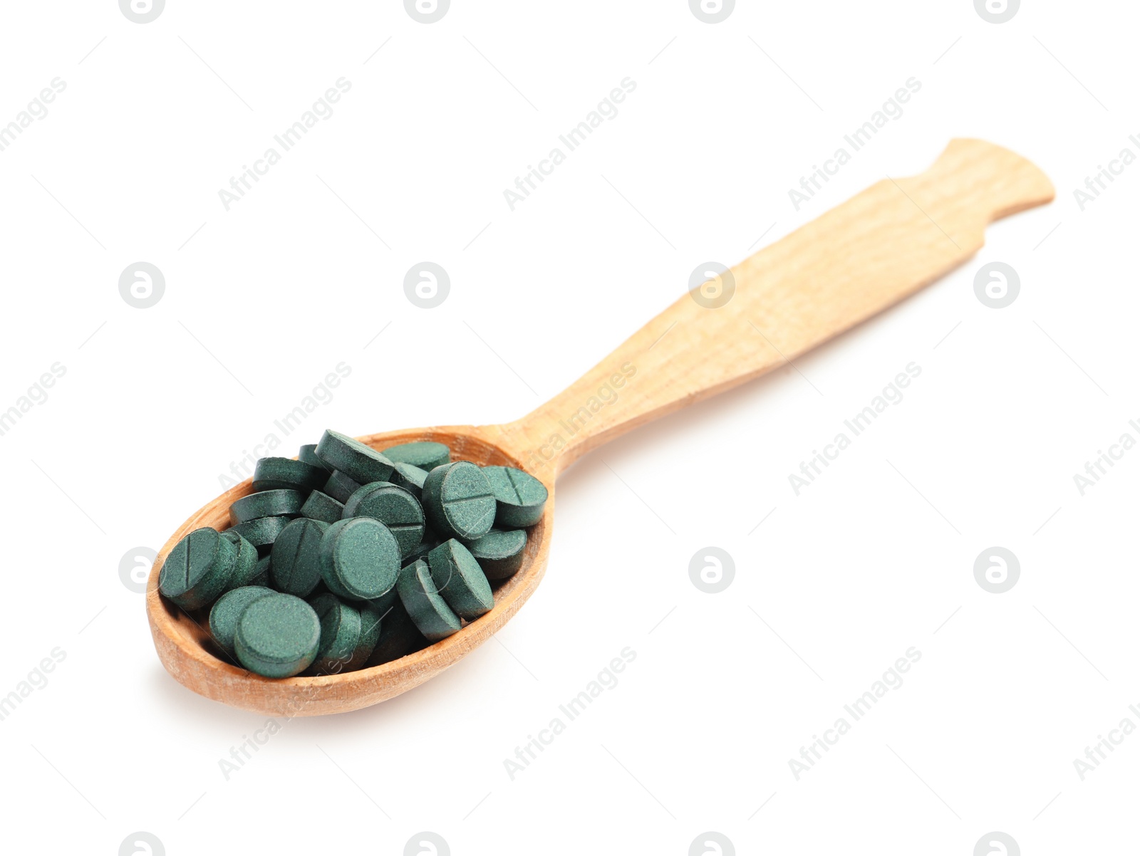 Photo of Spoon with spirulina tablets on white background