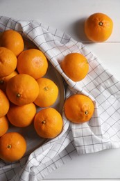 Photo of Many fresh ripe tangerines on white wooden table, flat lay