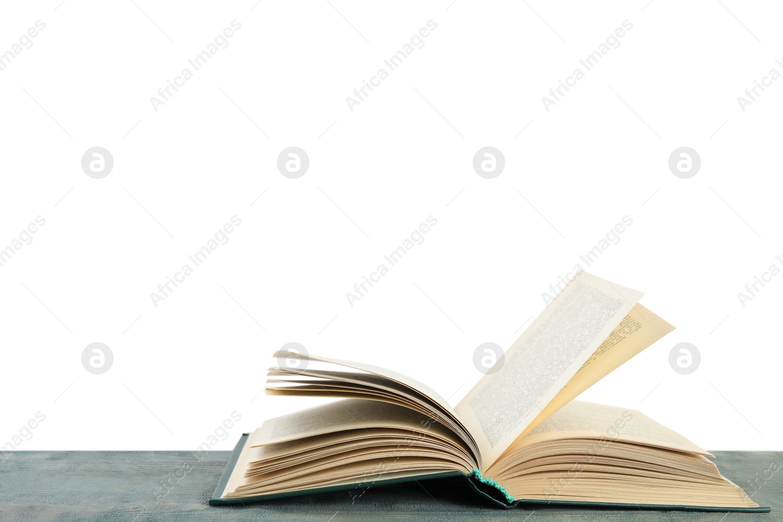 Photo of Open old hardcover book on wooden table