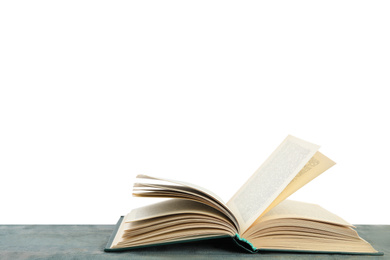 Open old hardcover book on wooden table