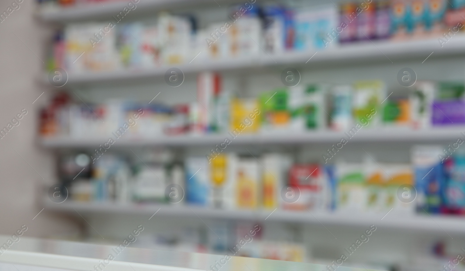 Photo of Blurred view of modern pharmacy interior with different medicine