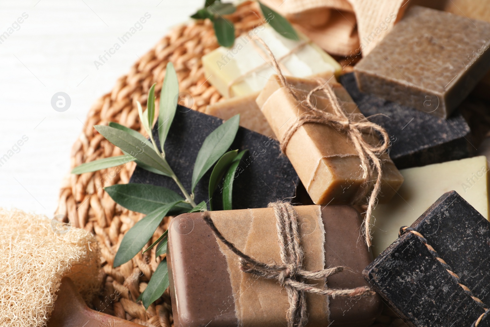 Photo of Pile of different handmade soap bars on table