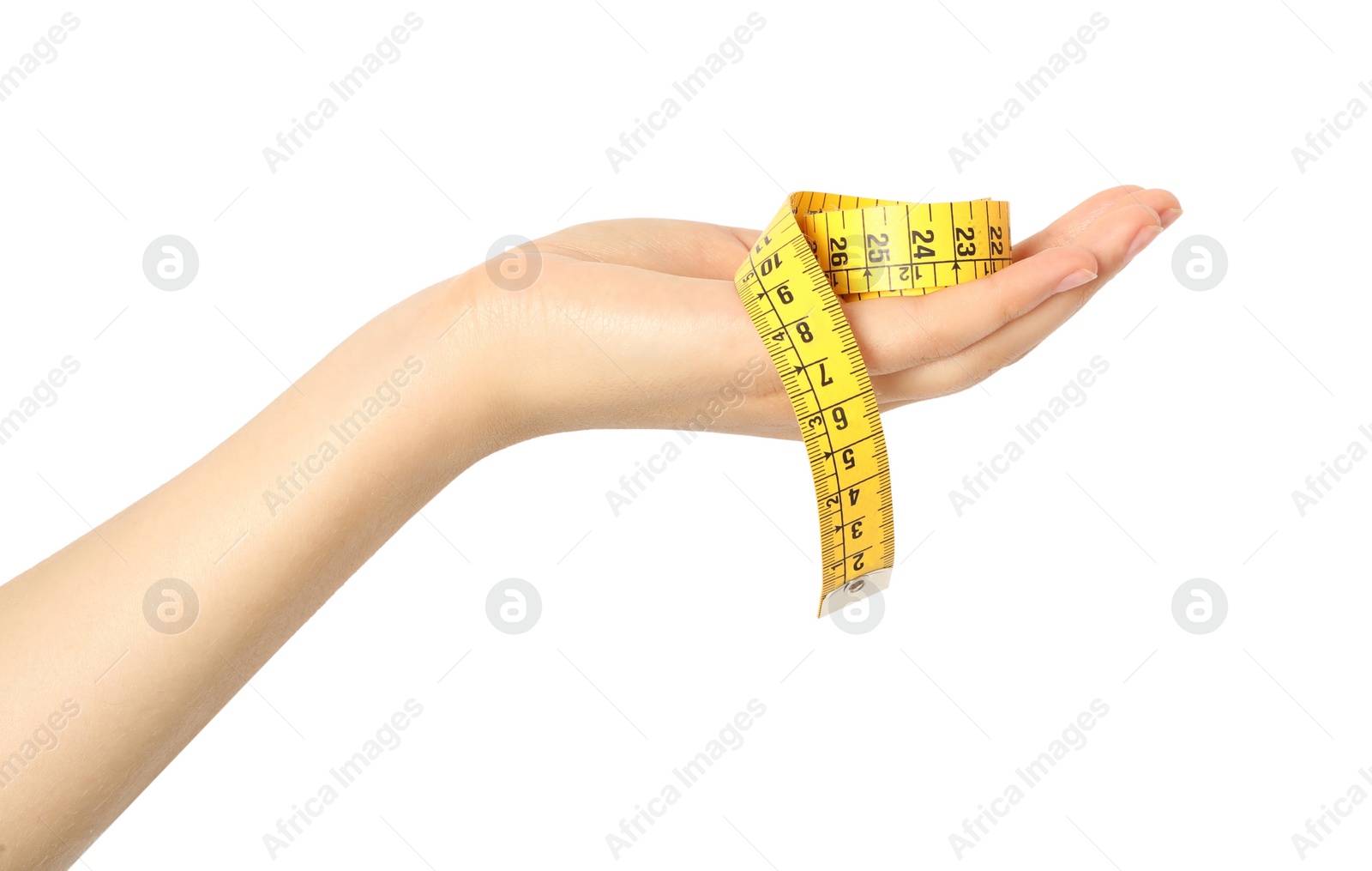 Photo of Woman holding yellow measuring tape on white background, closeup