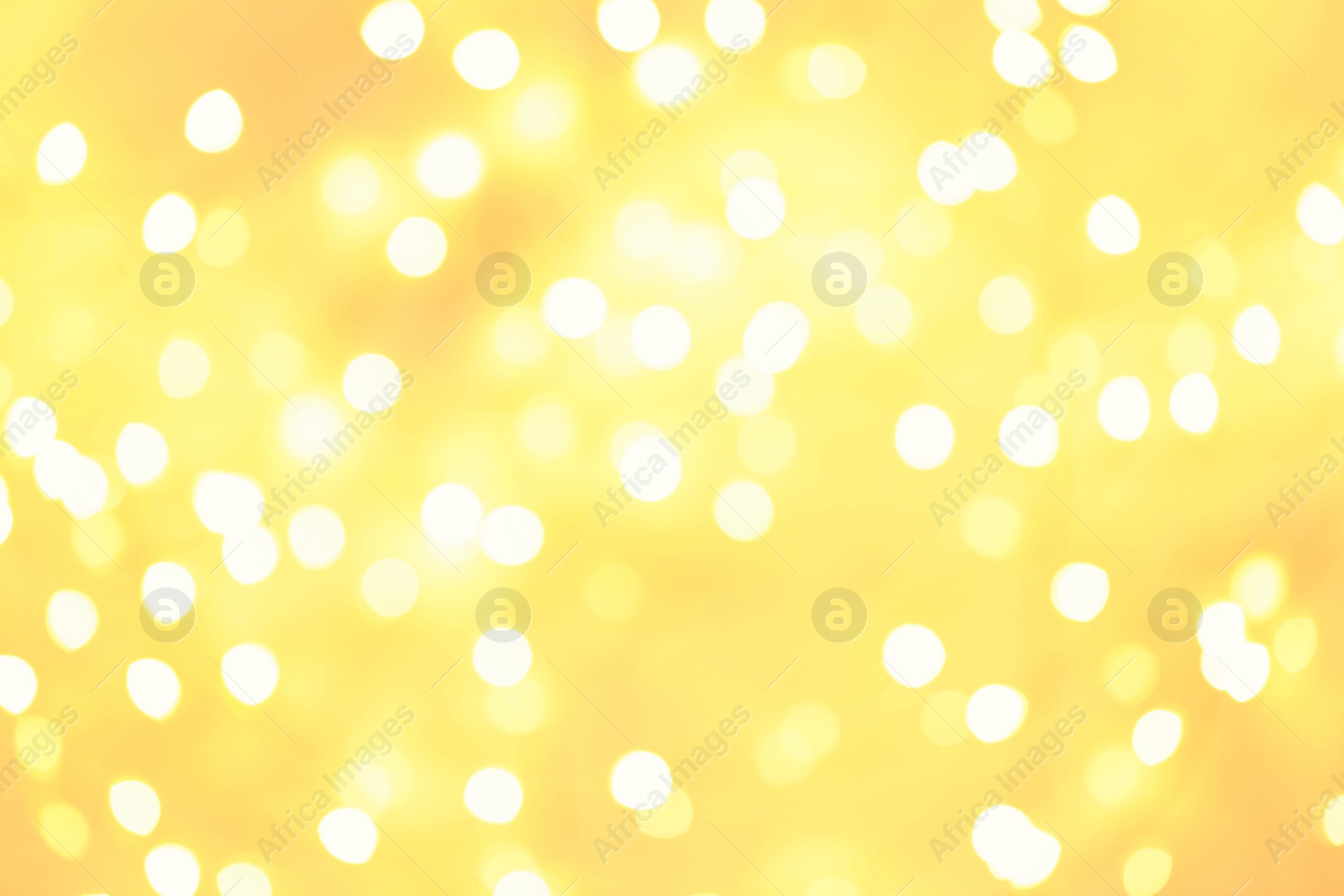 Photo of Beautiful golden lights as background. Bokeh effect