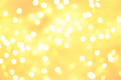 Photo of Beautiful golden lights as background. Bokeh effect