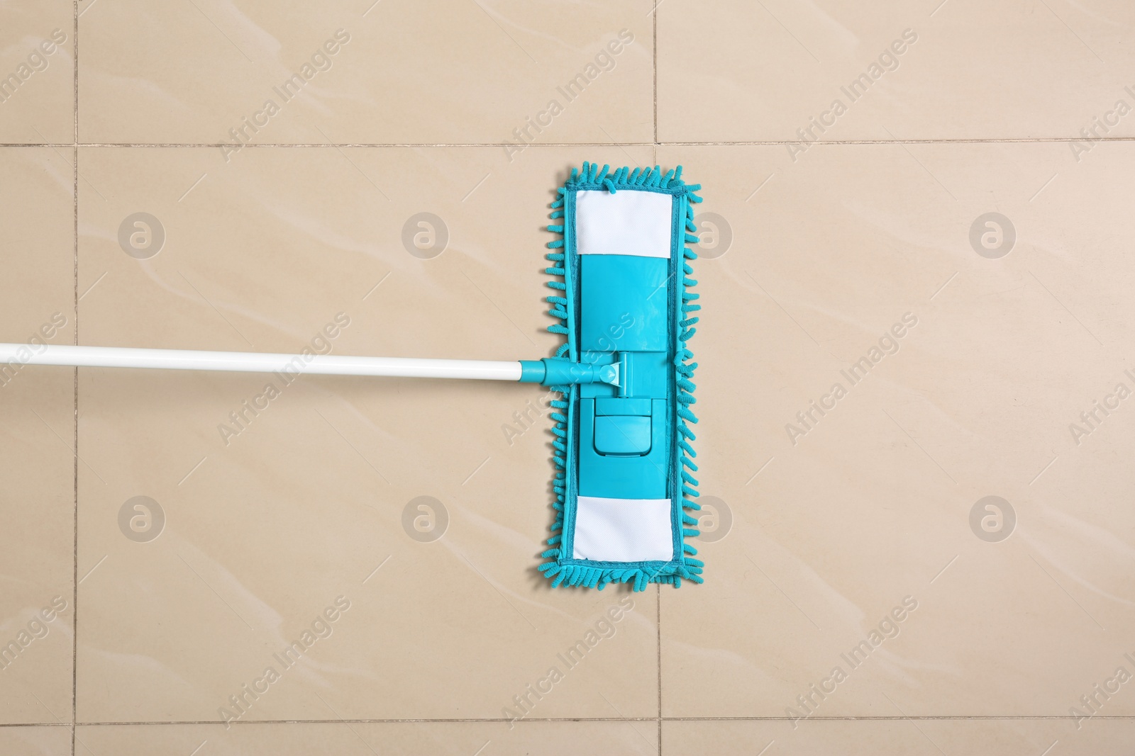 Photo of Cleaning of floor with mop, top view