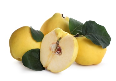 Photo of Ripe fresh quinces with green leaves on white background