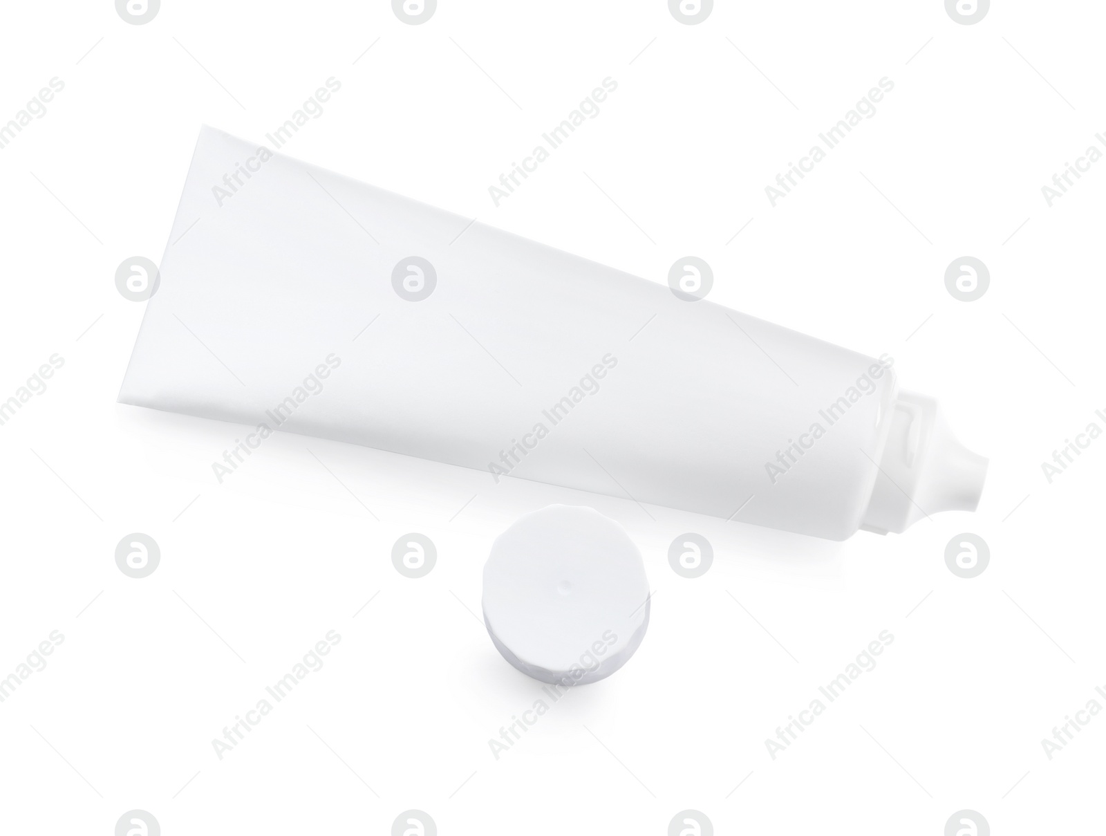 Photo of Blank tube of toothpaste isolated on white, top view