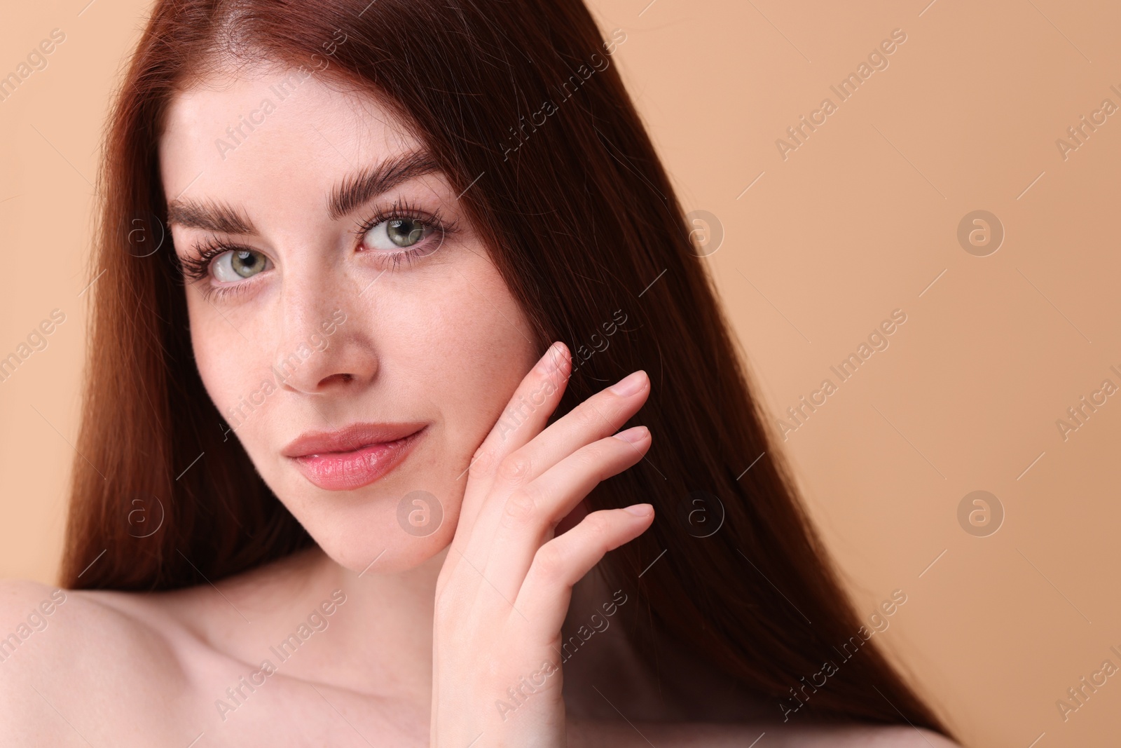 Photo of Portrait of beautiful woman on beige background, closeup