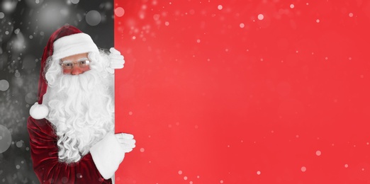 Image of Santa Claus with blank red banner on black background. Space for design