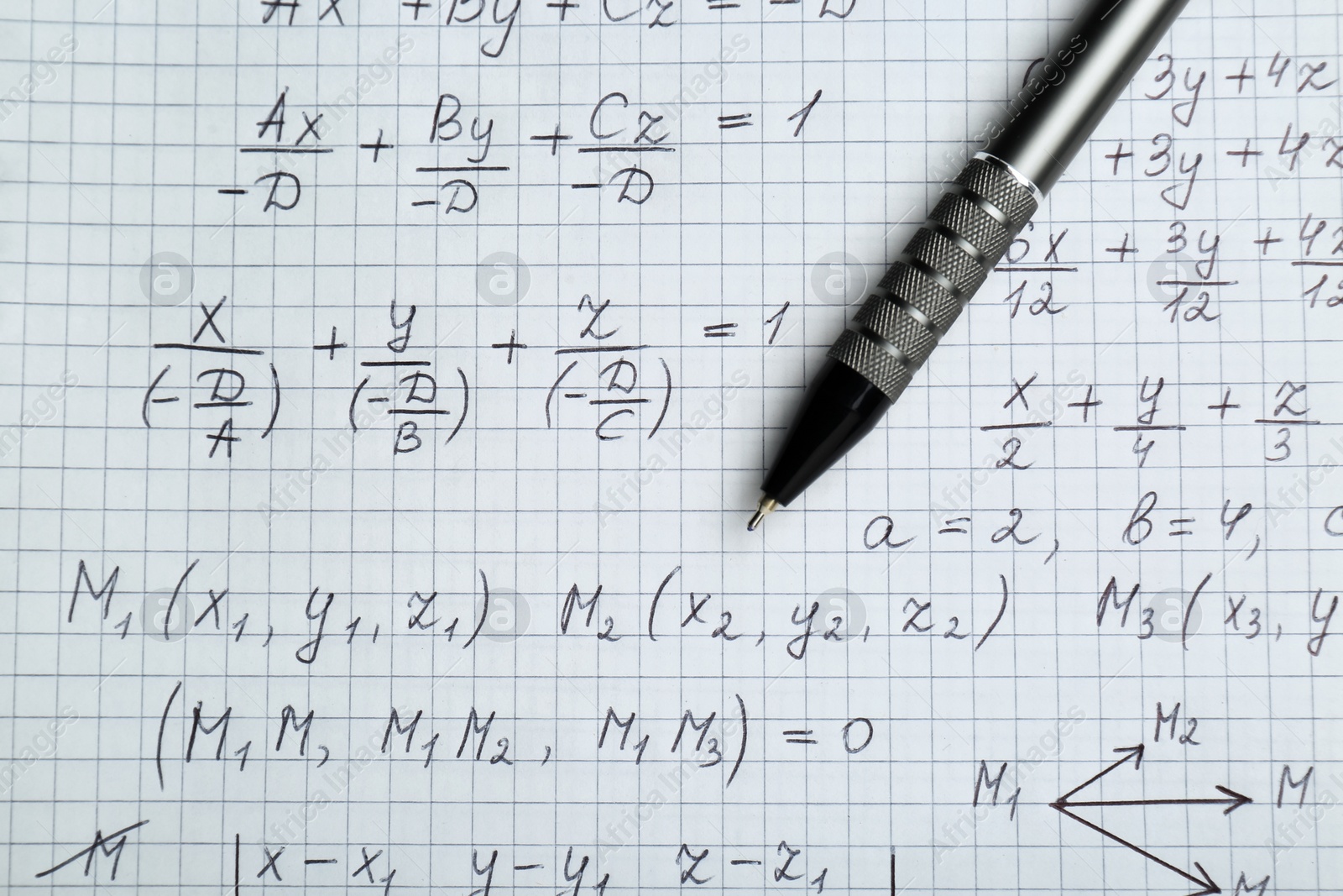 Photo of Sheet of paper with different mathematical formulas and pen, top view