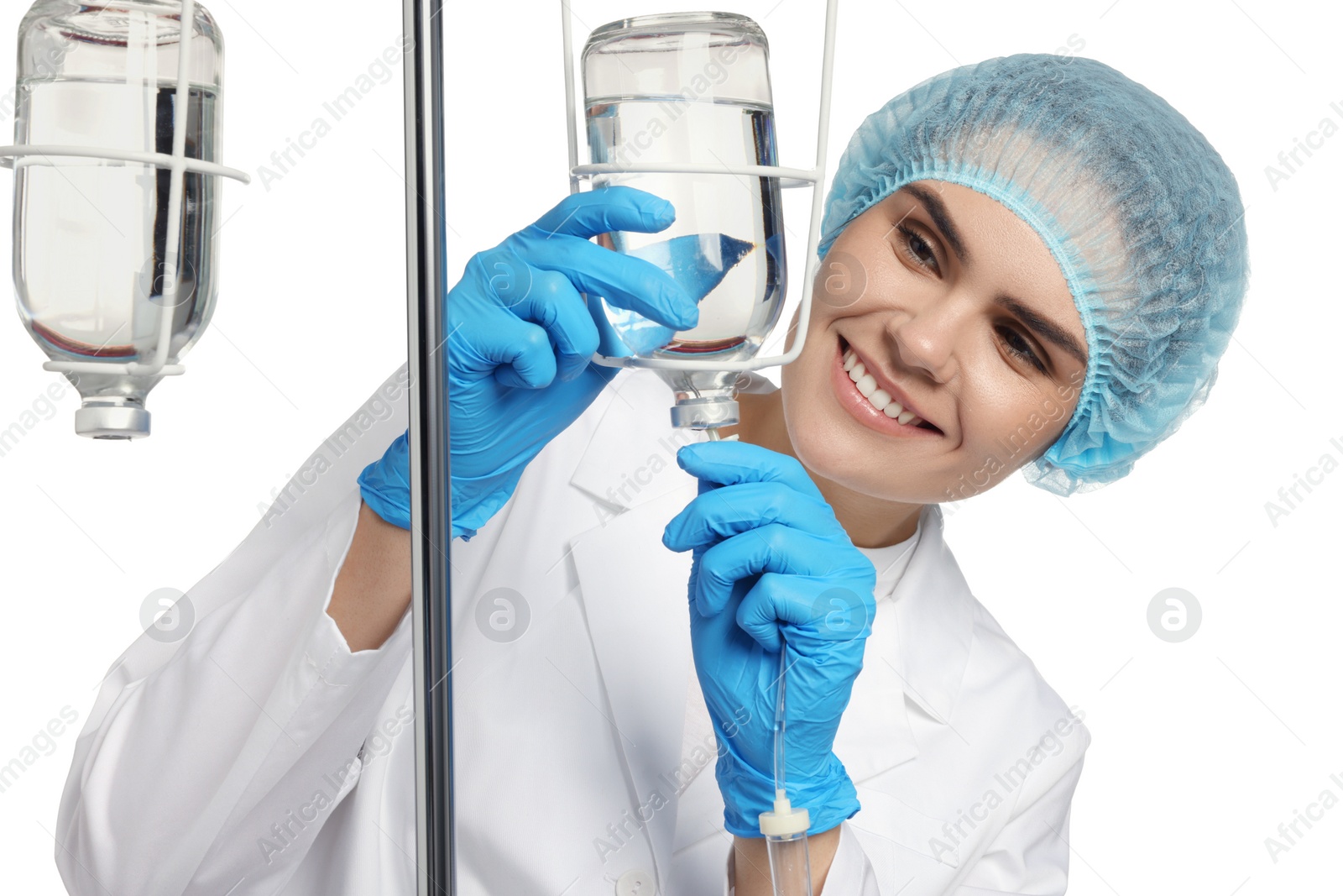 Photo of Nurse setting up IV drip on white background