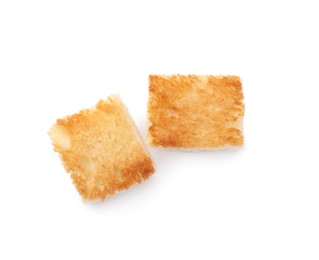 Delicious crispy croutons on white background, top view
