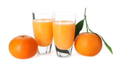 Photo of Tasty tangerine liqueur in shot glasses and fresh fruits isolated on white