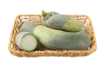 Photo of Green daikon radishes in wicker basket isolated on white