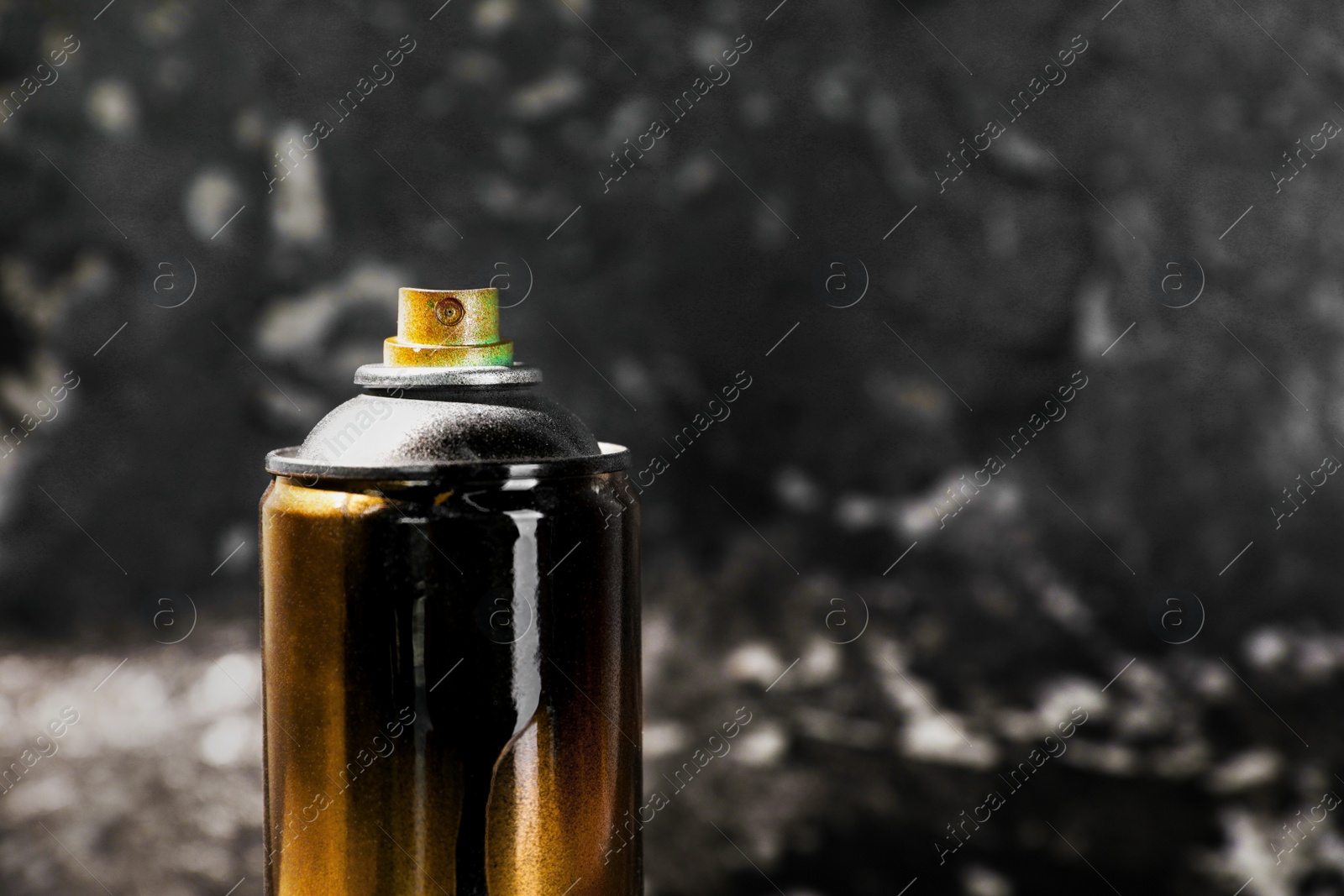 Photo of Used can of spray paint on black marble background, closeup. Space for text