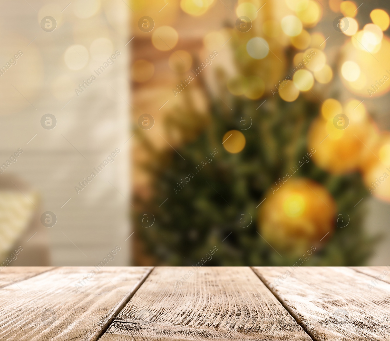 Image of Empty wooden surface and blurred view of Christmas tree in room, space for text. Interior design