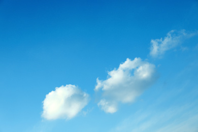 Photo of Beautiful light blue sky with fluffy clouds