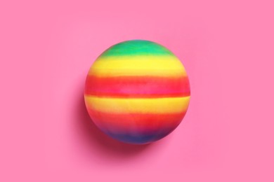 New bright kids' ball on pink background, top view