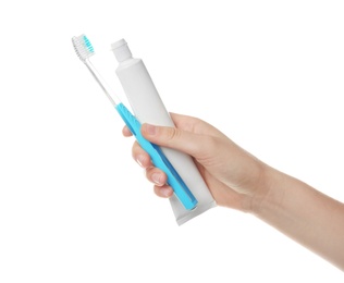 Photo of Woman holding toothbrush and paste against white background. Dental care