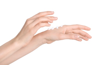 Photo of Young woman applying hand cream on white background