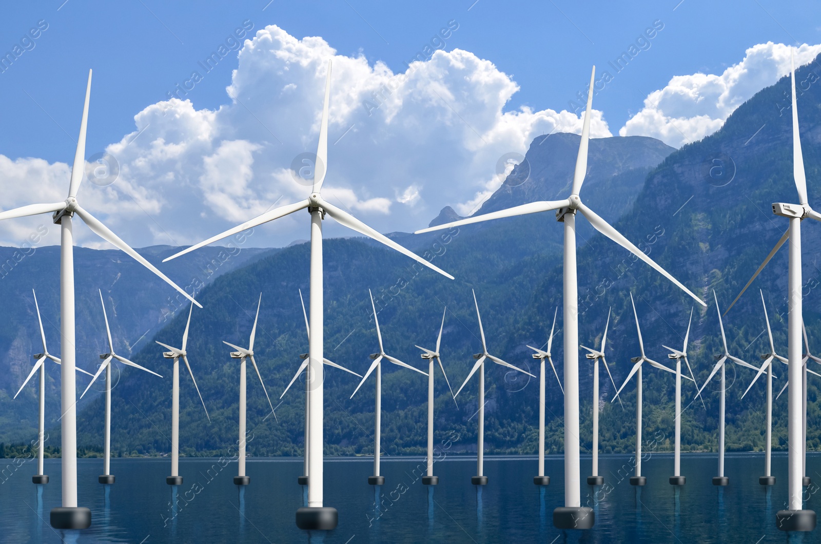 Image of Floating wind turbines installed in water near mountains. Alternative energy source