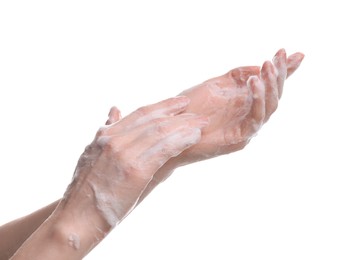 Woman washing hands with cleansing foam on white background, closeup