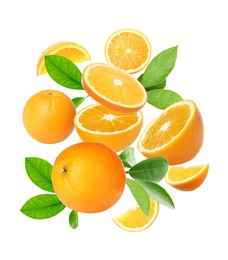 Image of Cut and whole oranges with green leaves flying on white background