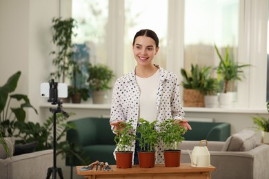 Photo of Teacher conducting online gardening course at home. Time for hobby