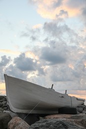 Photo of Picturesque view of sky with heavy clouds and boat on coast