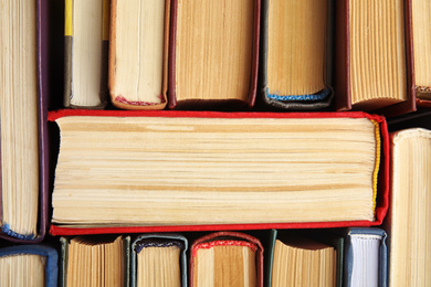 Photo of Many different hardcover books as background, top view