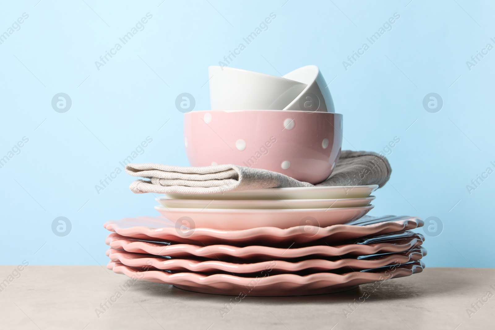 Photo of Beautiful ceramic dishware on light grey table