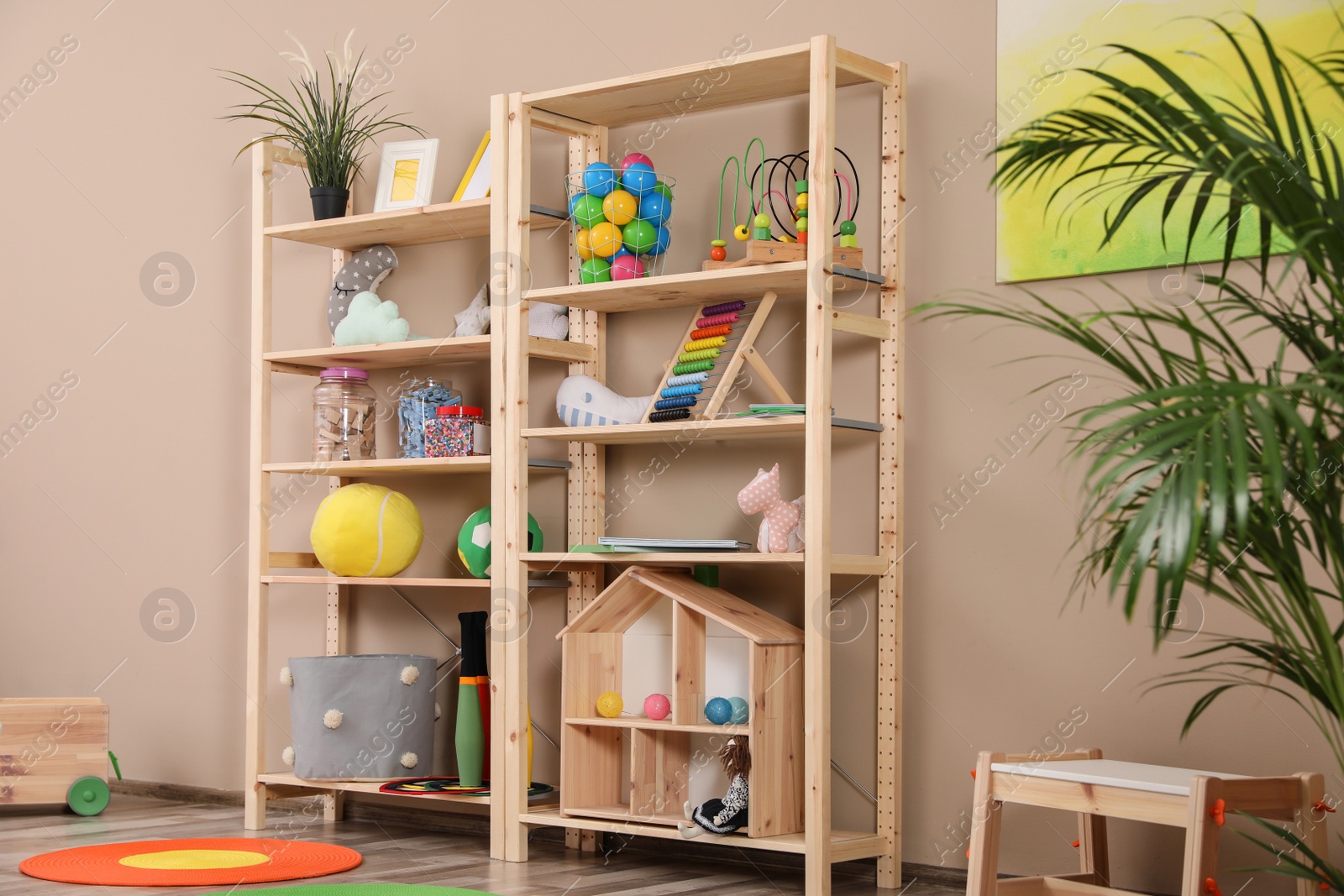 Photo of Storage for toys in colorful child's room. Idea for interior design