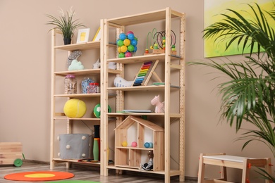 Storage for toys in colorful child's room. Idea for interior design