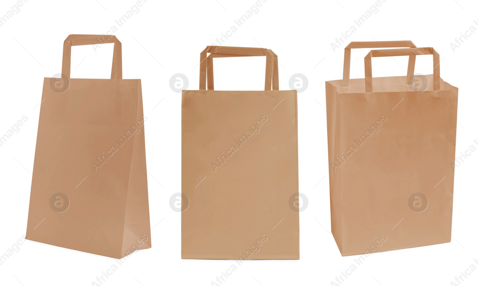 Image of Set with kraft paper bags on white background