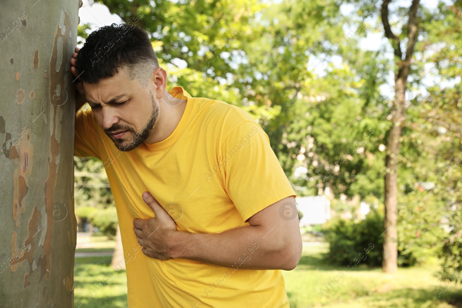 Photo of Man suffering from heat stroke in park