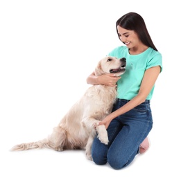 Young woman and her Golden Retriever dog on white background