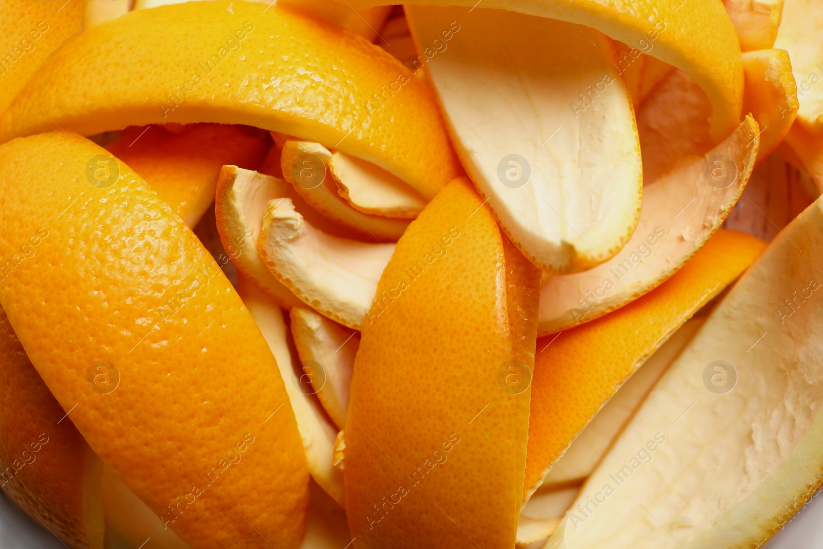 Photo of Orange peels preparing for drying on white wooden table, closeup