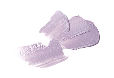 Photo of Strokes of purple color correcting concealer isolated on white, top view