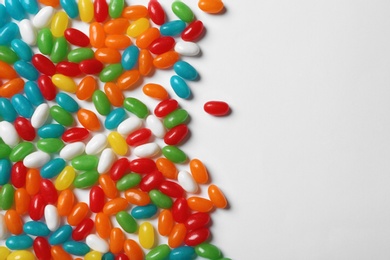 Photo of Colorful jelly candies on white background, top view