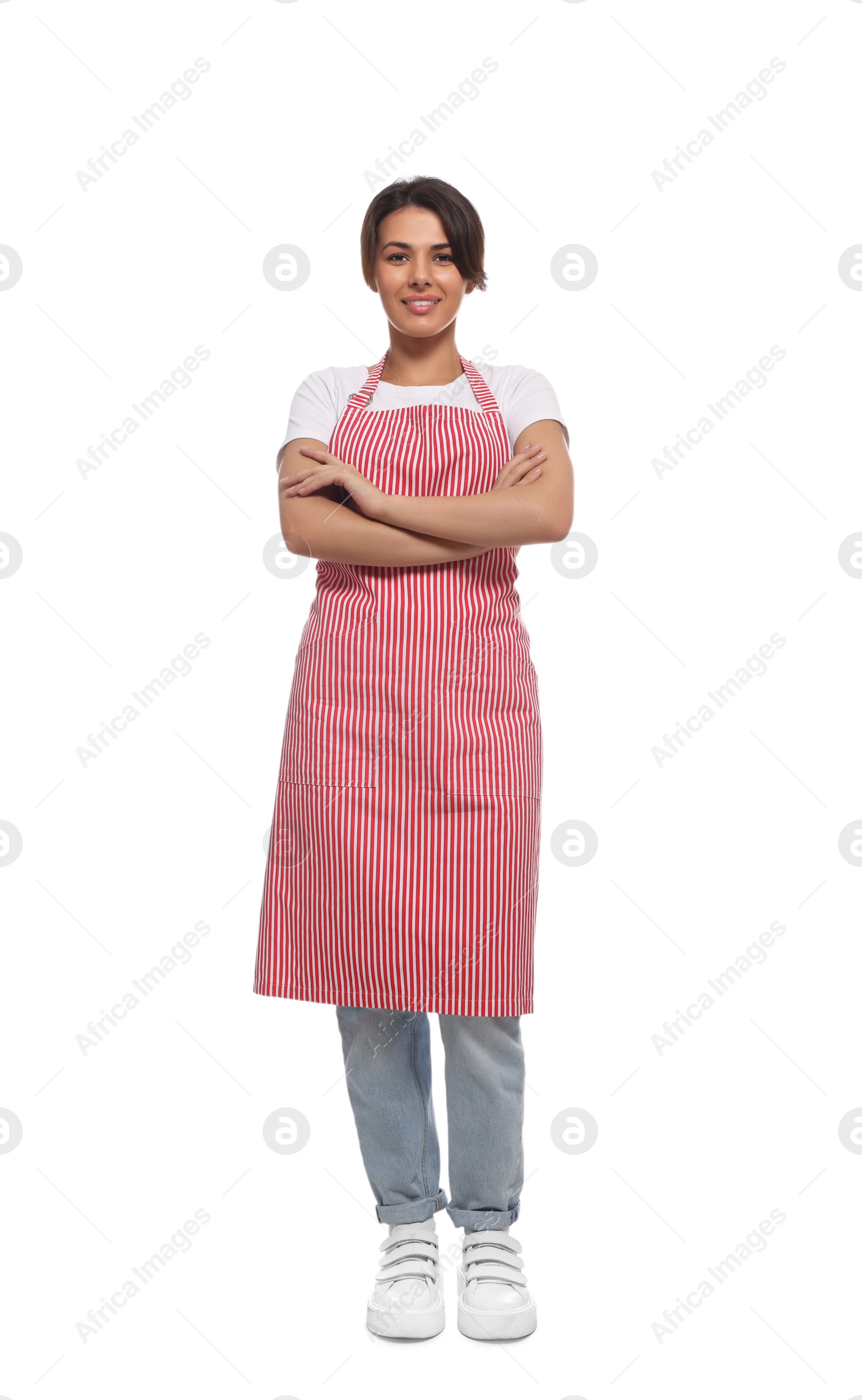 Photo of Young woman in red striped apron on white background