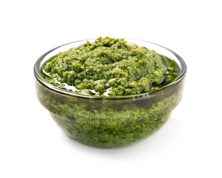 Photo of Bowl of tasty arugula pesto on white background