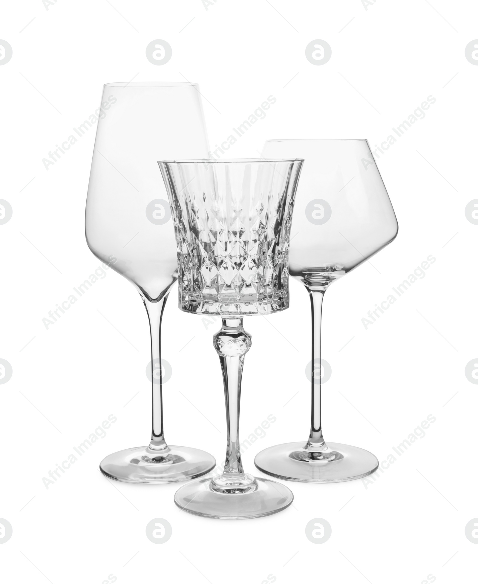 Photo of Elegant clean empty wine glasses isolated on white