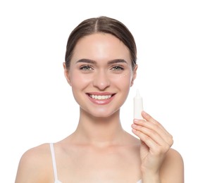 Photo of Young woman holding tube of eye cream on white background