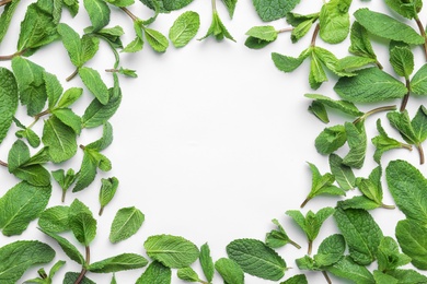 Photo of Frame made of fresh green mint leaves on white background, top view. Space for text