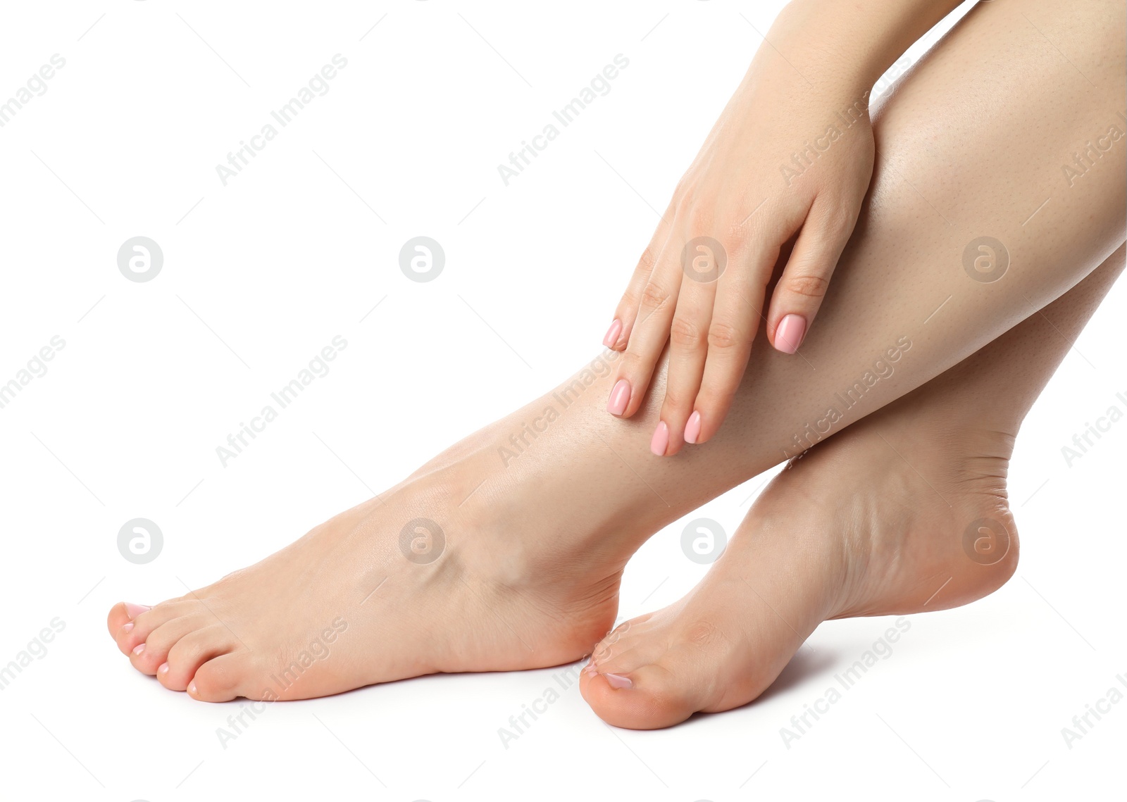 Photo of Woman with neat toenails after pedicure procedure isolated on white, closeup
